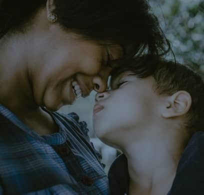 mother and son doing nose to nose