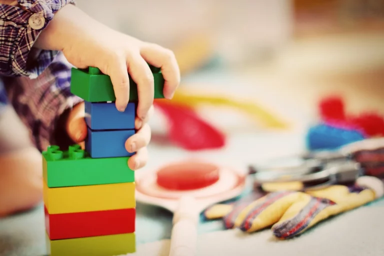 child building Lego blocks