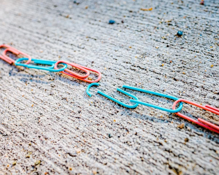 broken paper clips on the floor