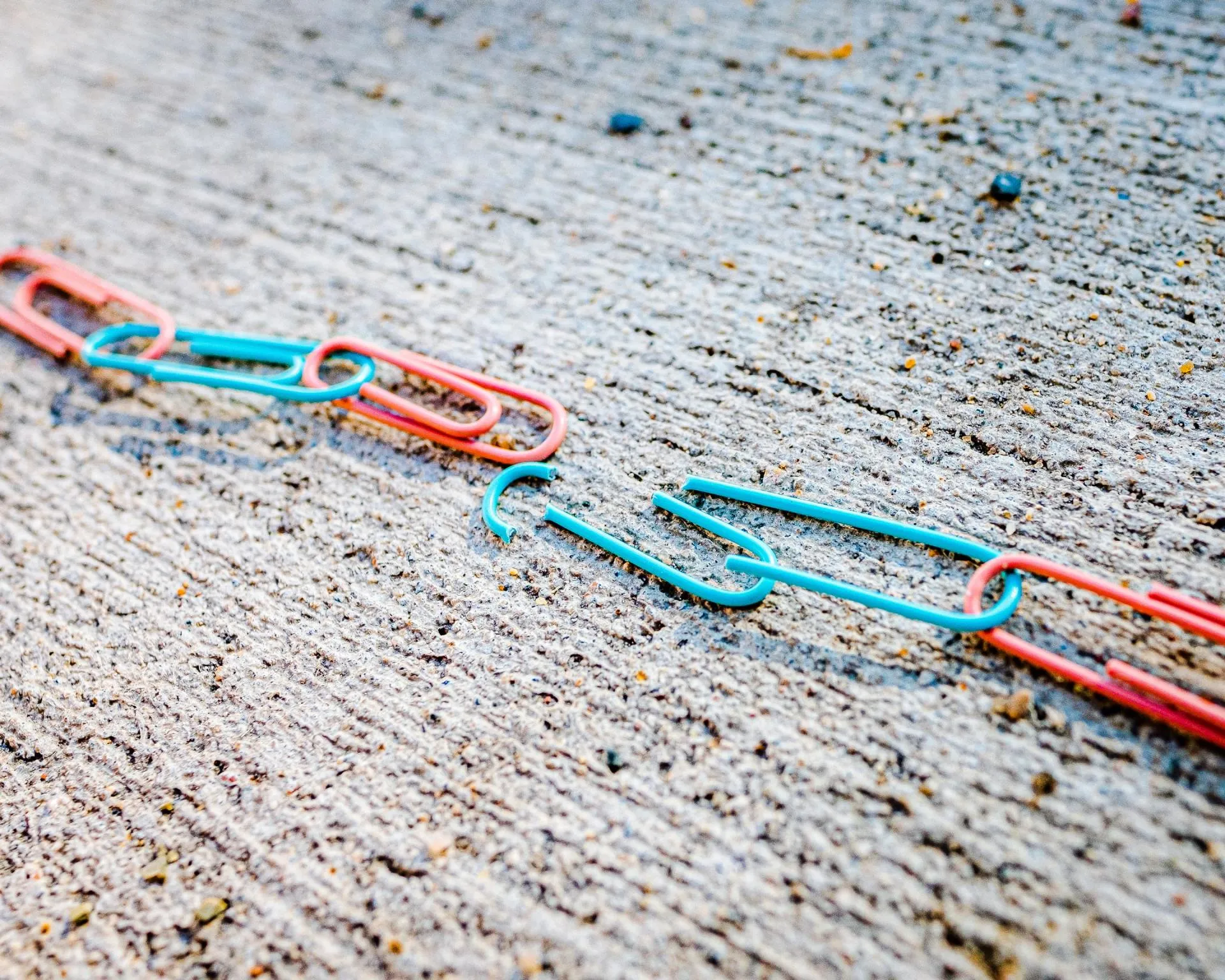 broken paper clips on the floor