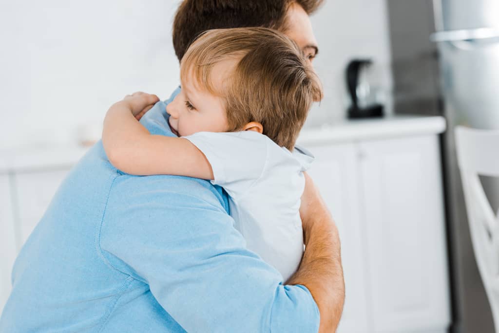 father-hugging-his-young-son